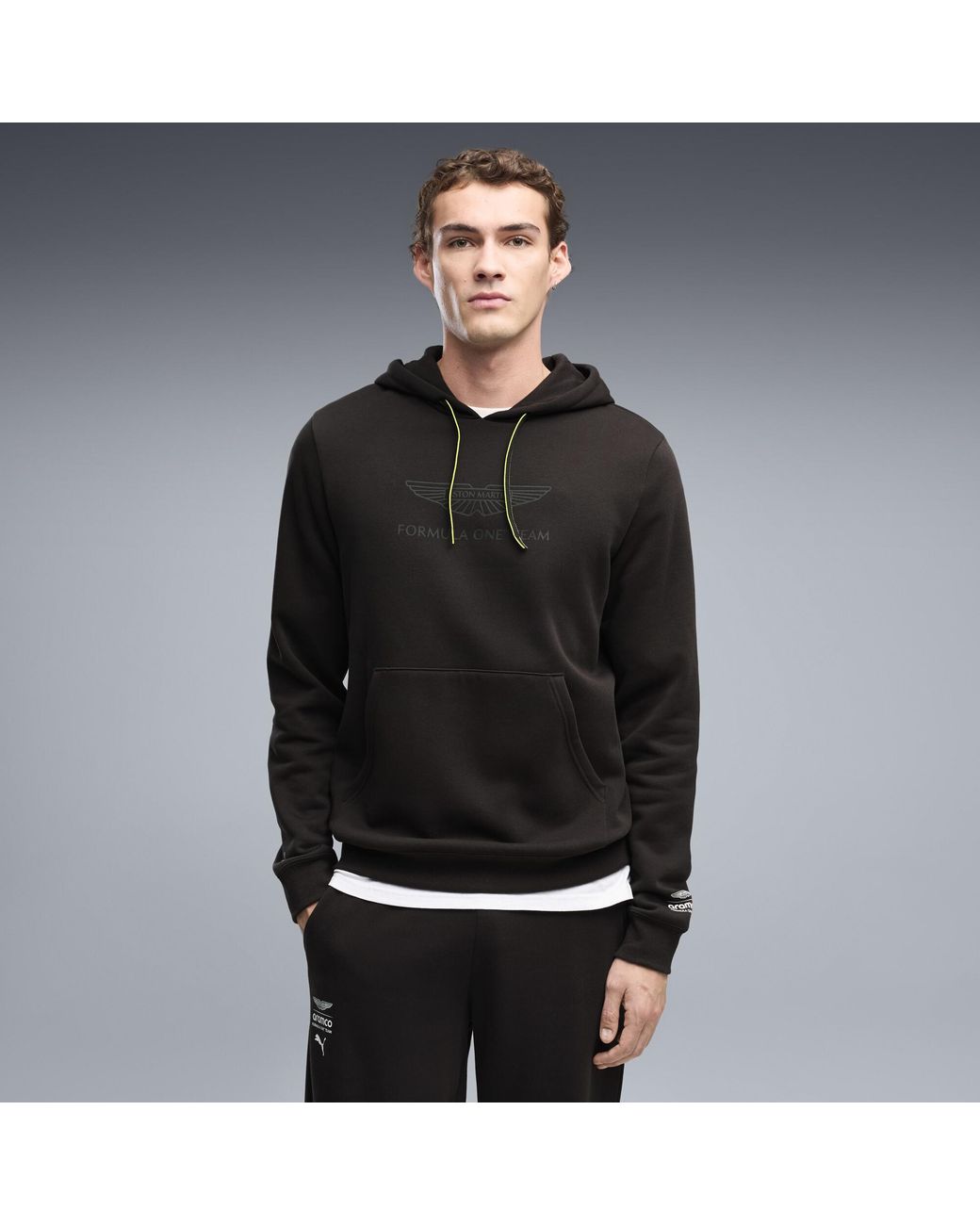 PUMA Black X Aston Martin Aramco F1 Team Essentials Hoodie for men
