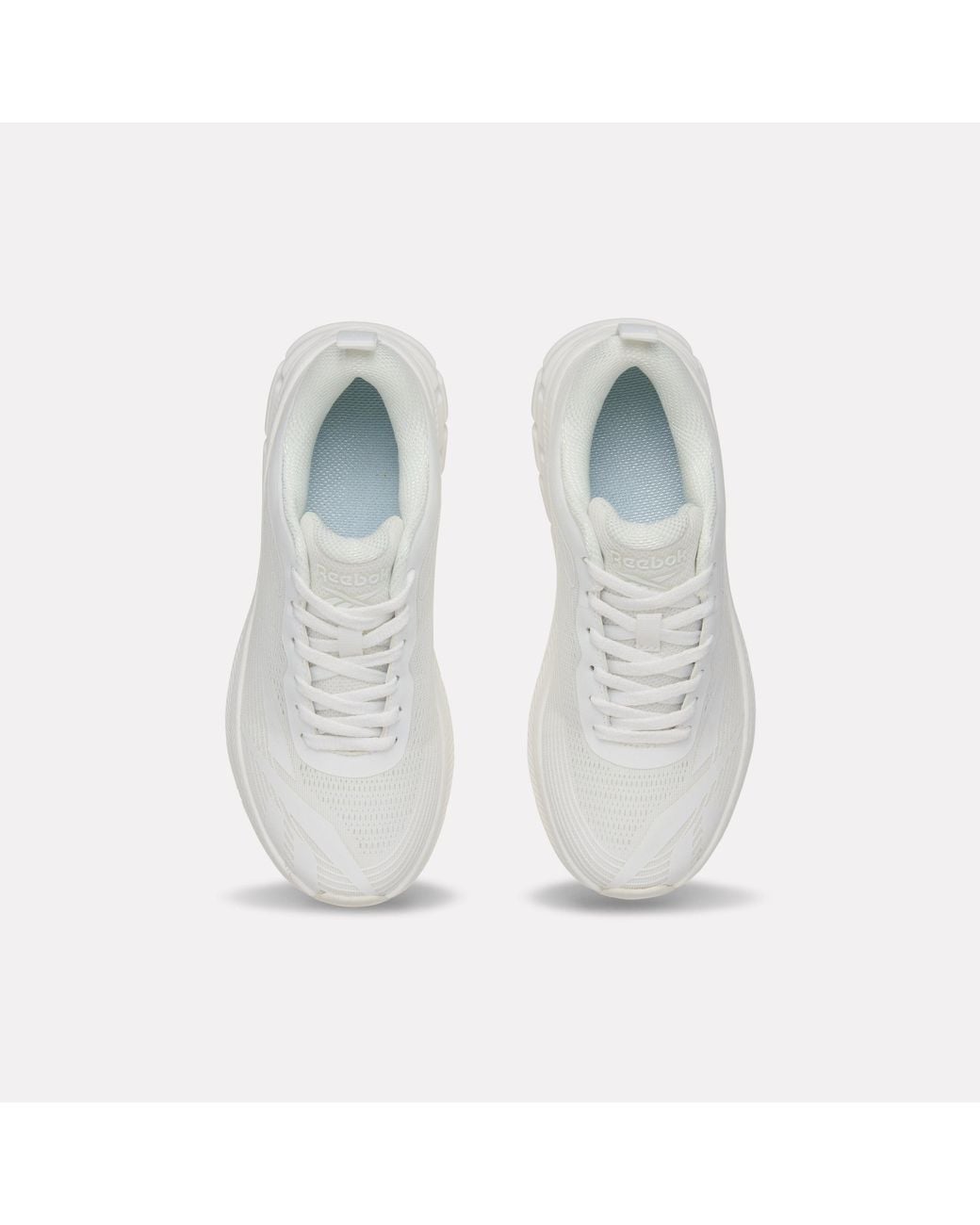 Reebok White Road Strider Junior Trainers