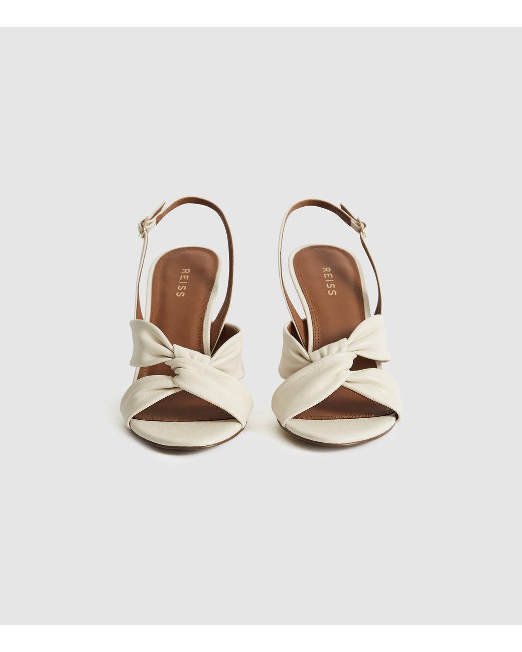 white leather slingbacks