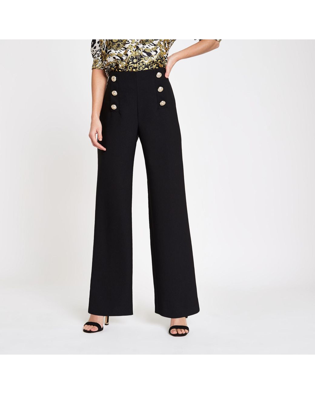 Kick flare trousers with goldtoned buttons  Massimo Dutti