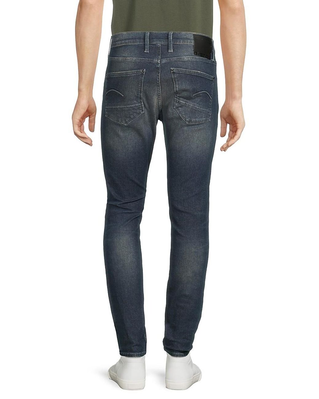 Distressed star jeans sales