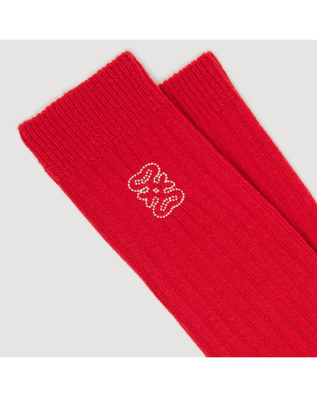 Chaussettes côtelées à logo Sandro en coloris Red