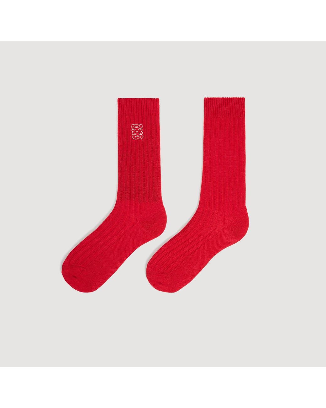 Chaussettes côtelées à logo Sandro en coloris Red