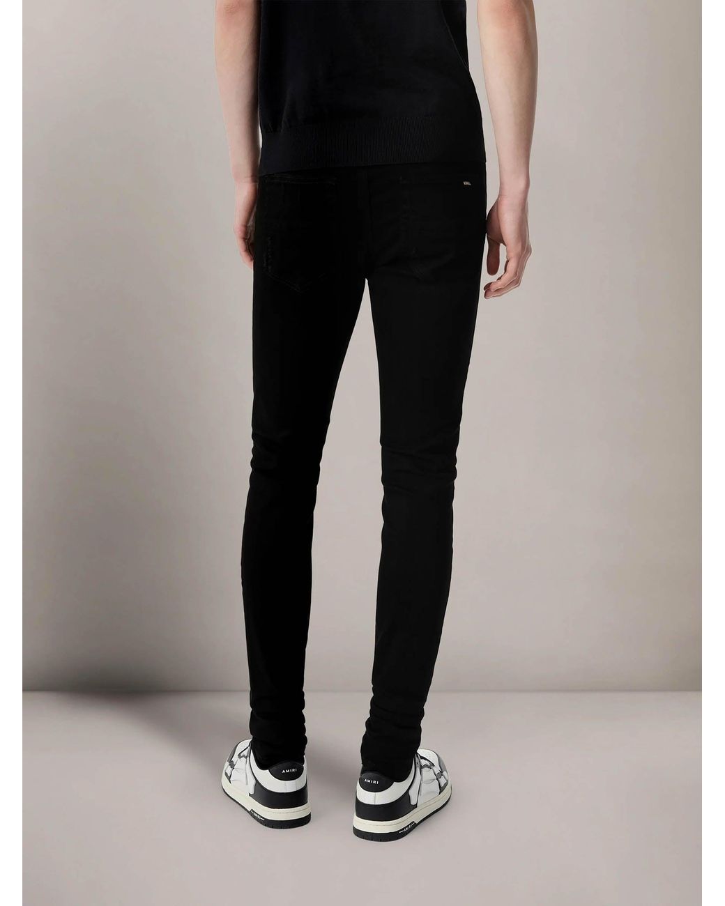 Amiri Black Ripped Slim Jeans for men
