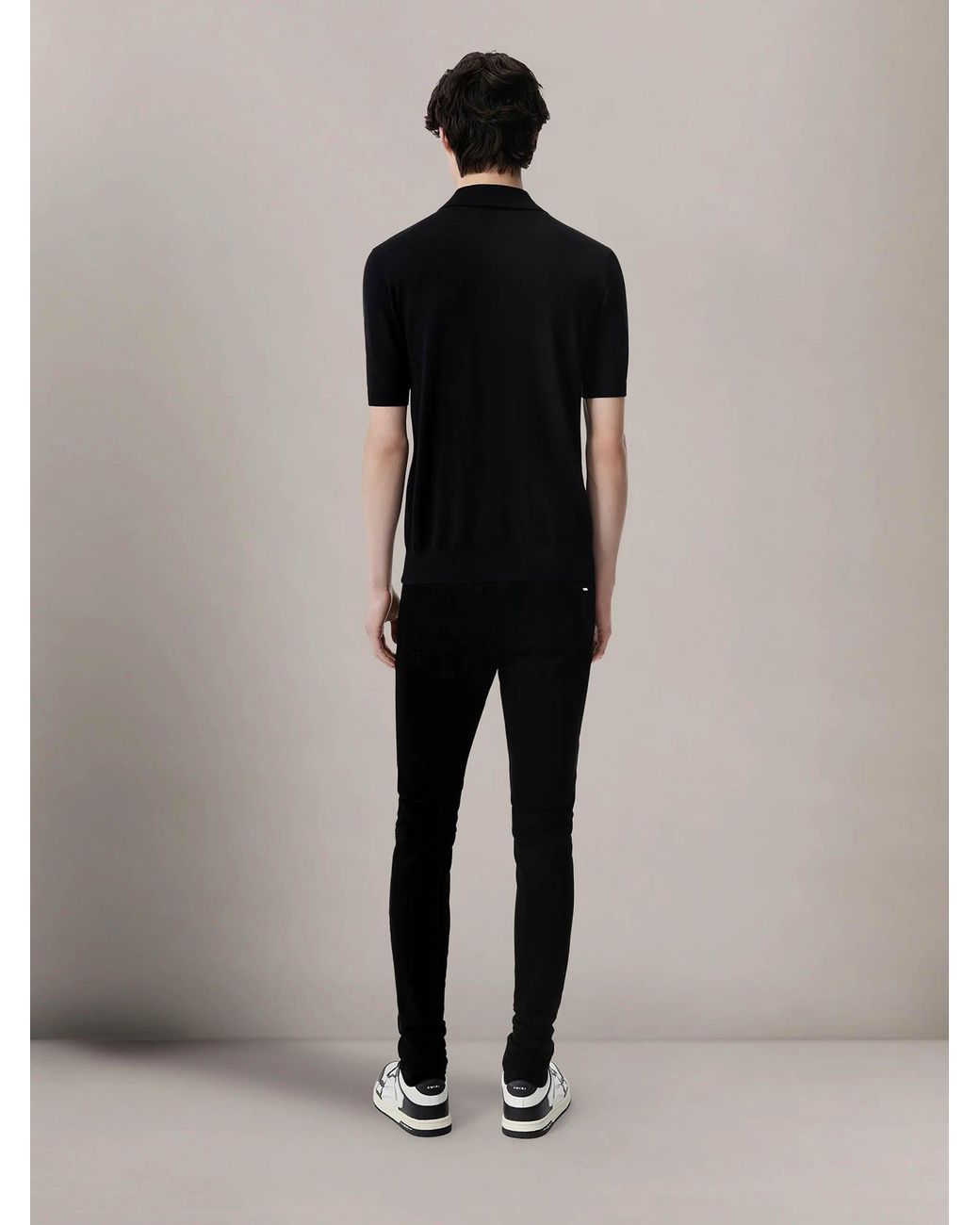 Amiri Black Ripped Slim Jeans for men