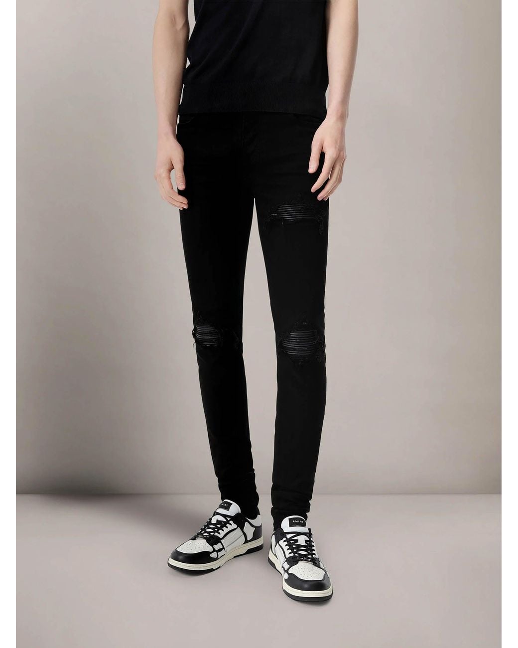 Amiri Black Ripped Slim Jeans for men