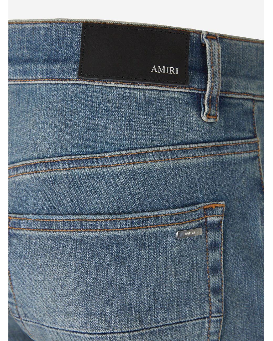 Amiri Blue Ripped Slim Jeans for men