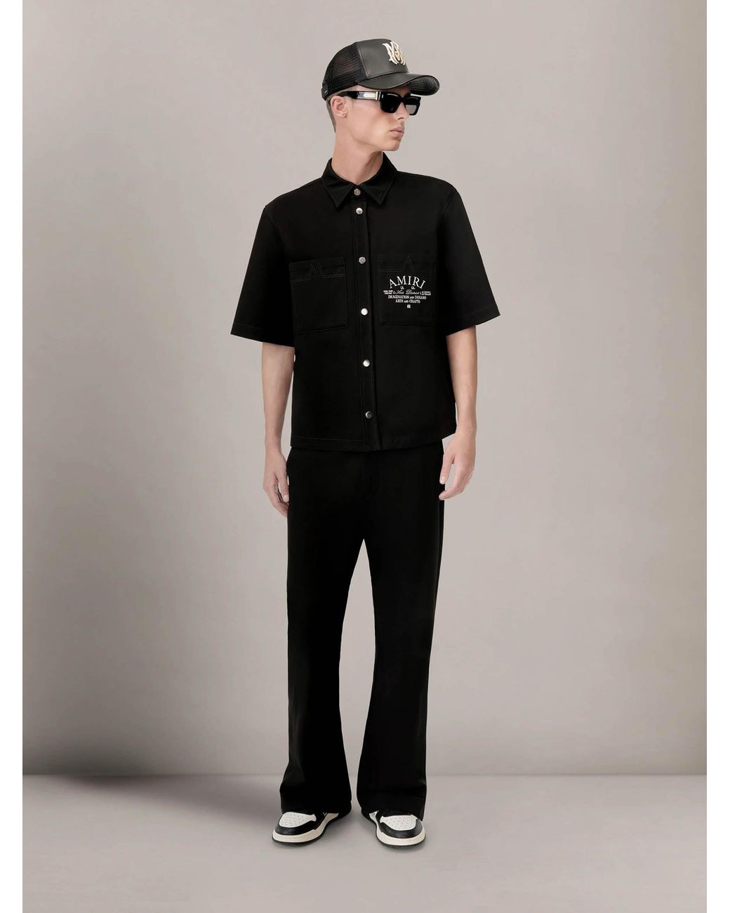 Amiri Black Flared Logo Pants for men