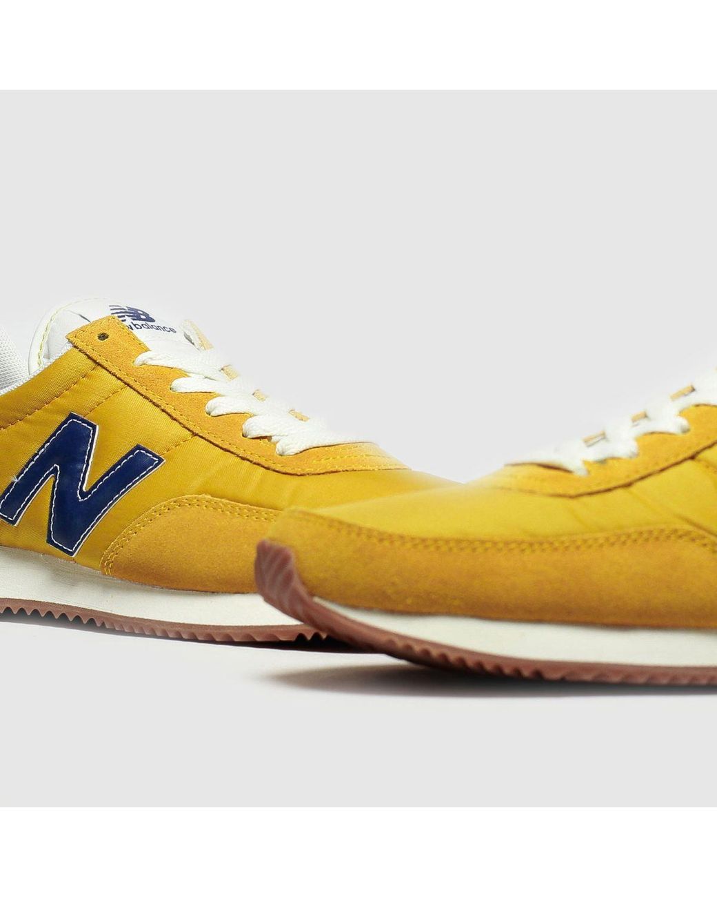 new balance trainers blue and yellow