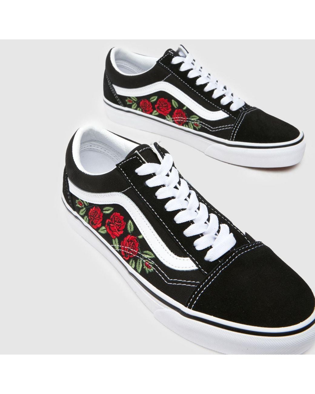 black vans with white roses