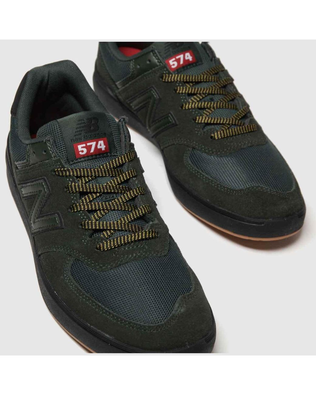 new balance dark green 574 trainers