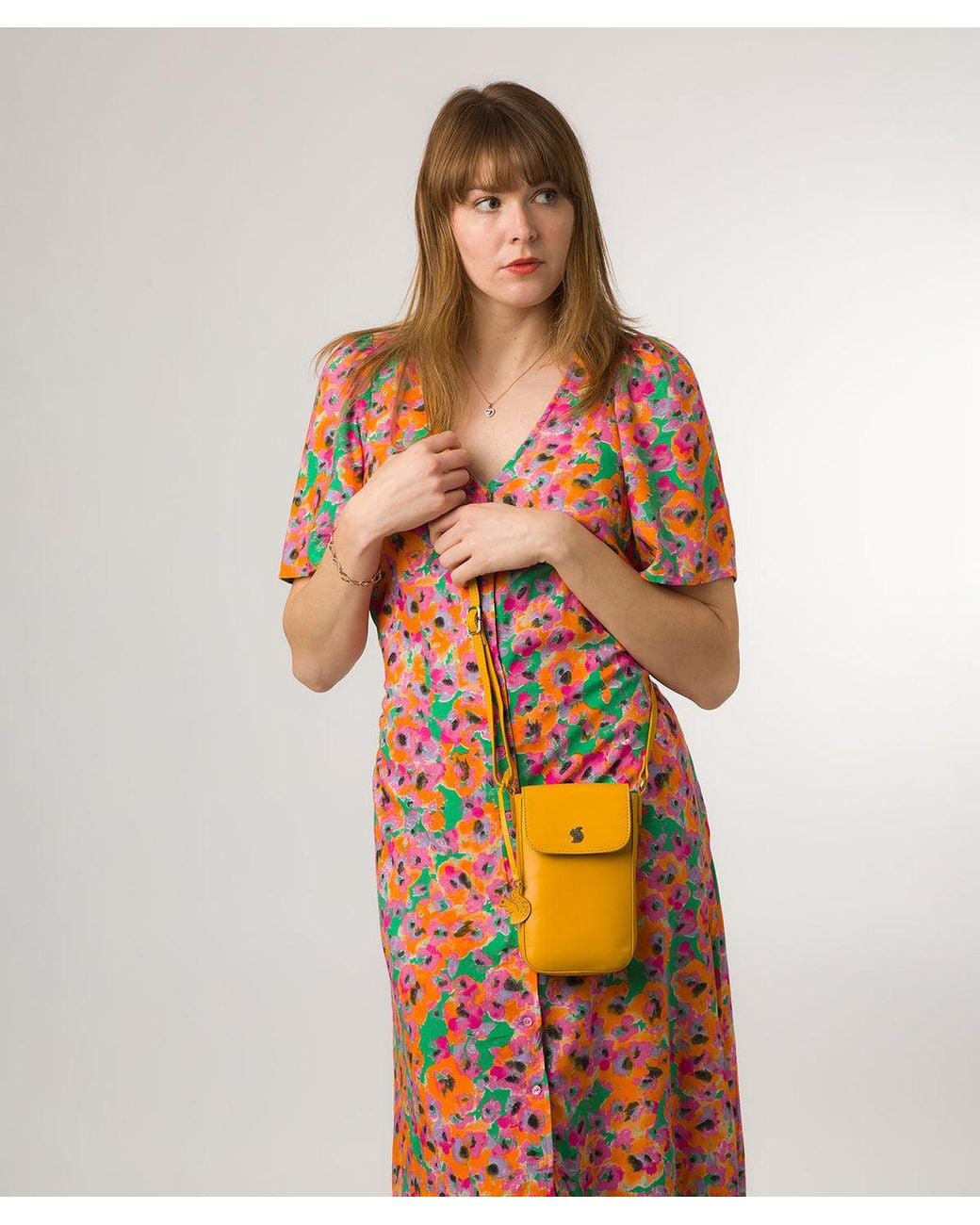 Conkca Orange 'Buzz' Lemon Drop Leather Cross Body Phone Bag