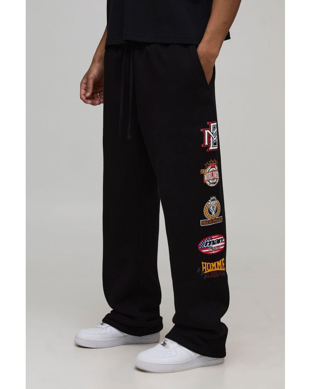BoohooMAN Black Baggy Fit Varsity Badge Print Joggers for men