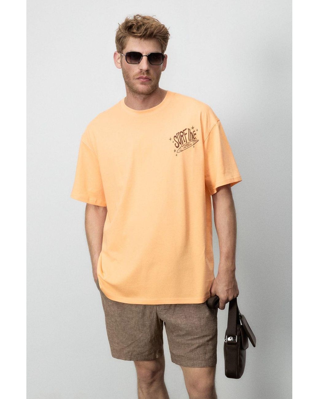 Grimelange Orange Oversized Printed Crew Neck T-Shirt for men