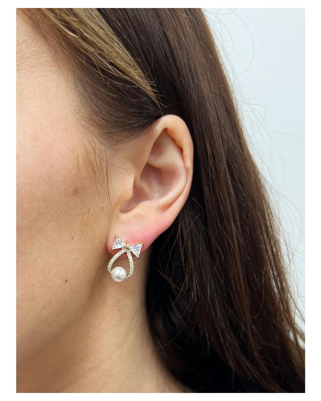 SVNX White Studded Bow Earrings With Hanging Pearl