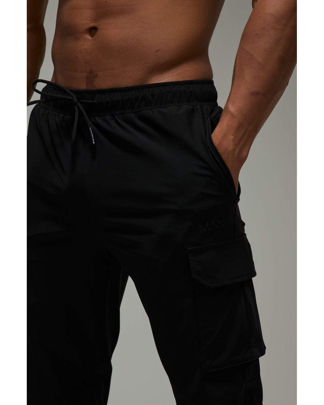 BoohooMAN Black Active Slim Fit Cuffed Cargo Jogger for men