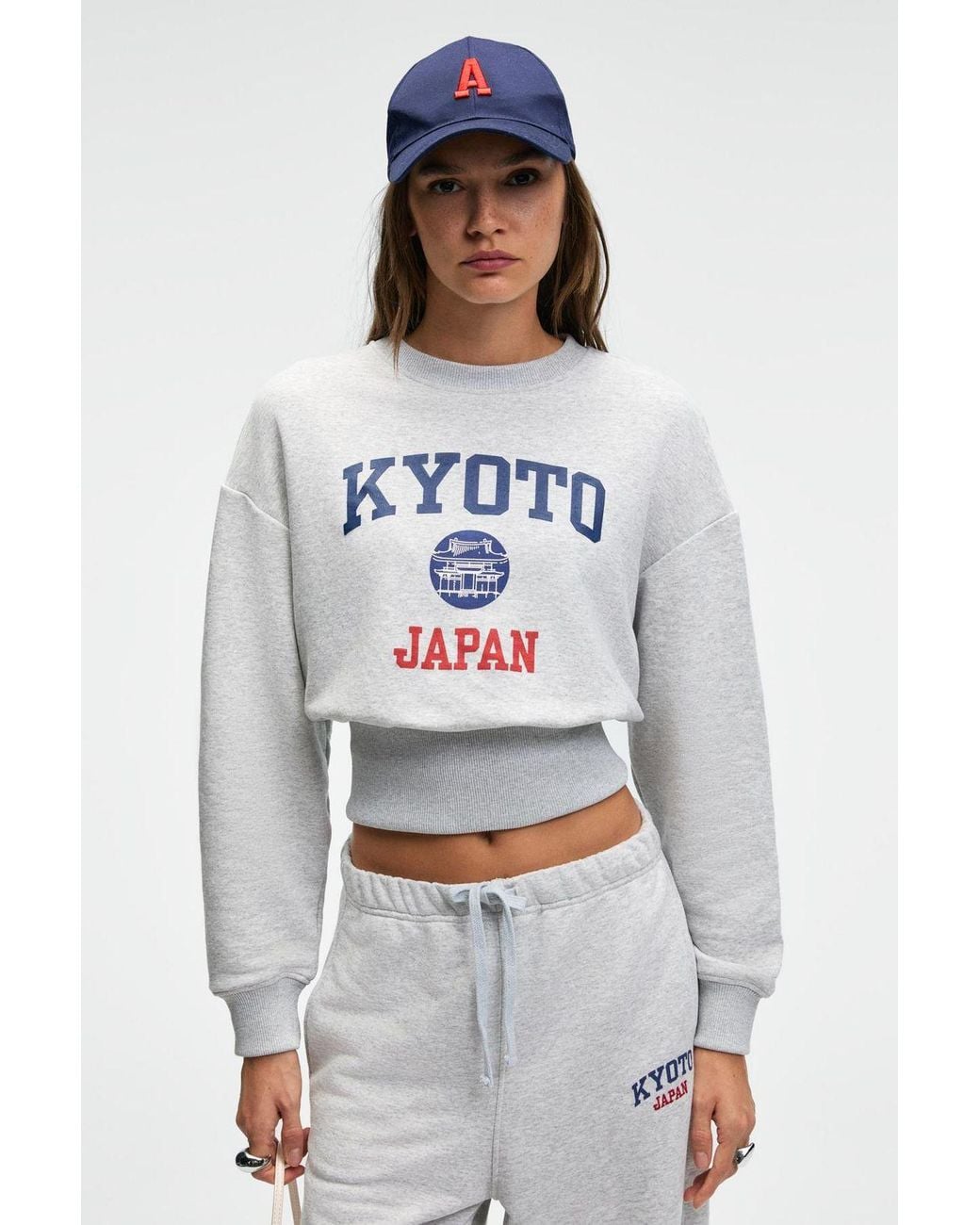 Grimelange White Crop Crew Neck Printed Sweatshirt