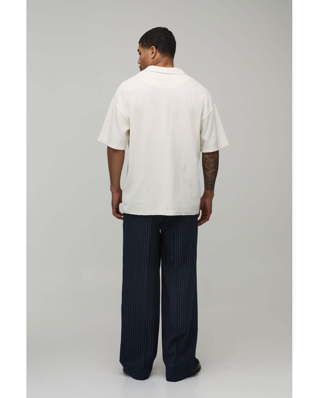 BoohooMAN Blue Baggy Fit Pinstripe Pleat Front Tailored Trousers for men