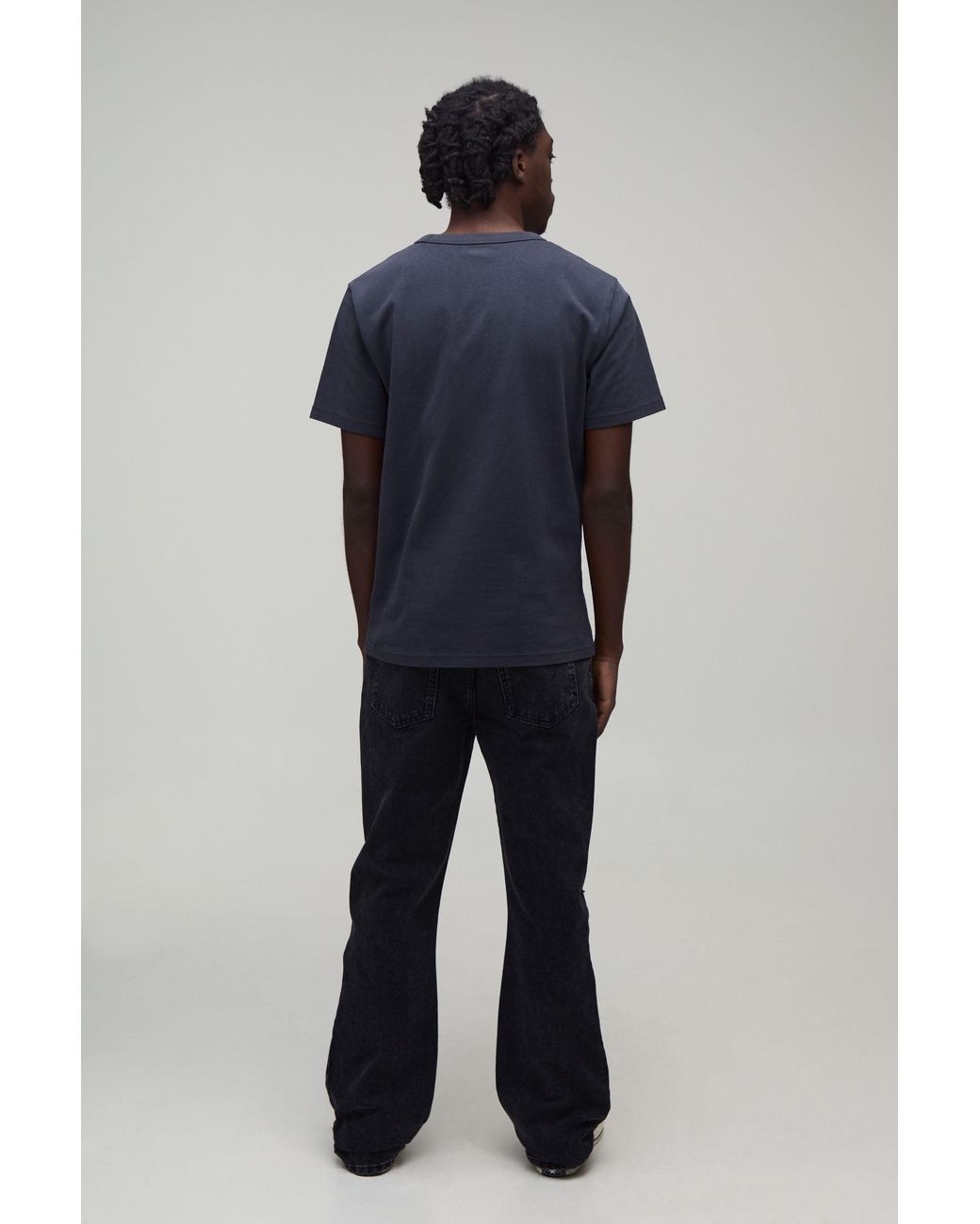 BoohooMAN Black All Over Ripped Stacked Gusset Slim Flared Jeans for men