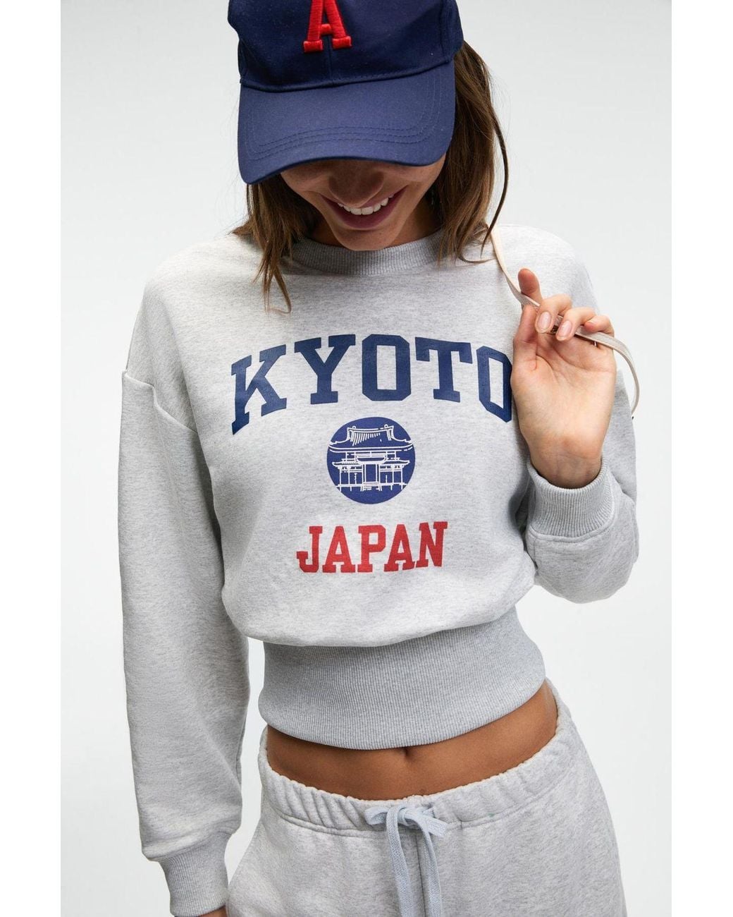 Grimelange White Crop Crew Neck Printed Sweatshirt
