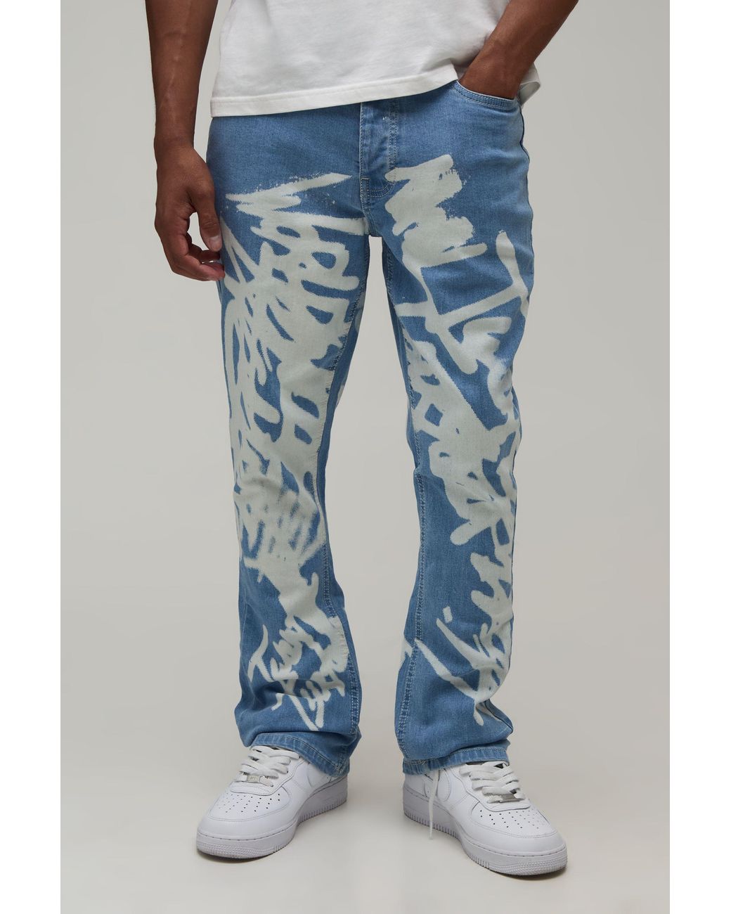 BoohooMAN Blue Stacked Graffiti Print Flared Jeans for men
