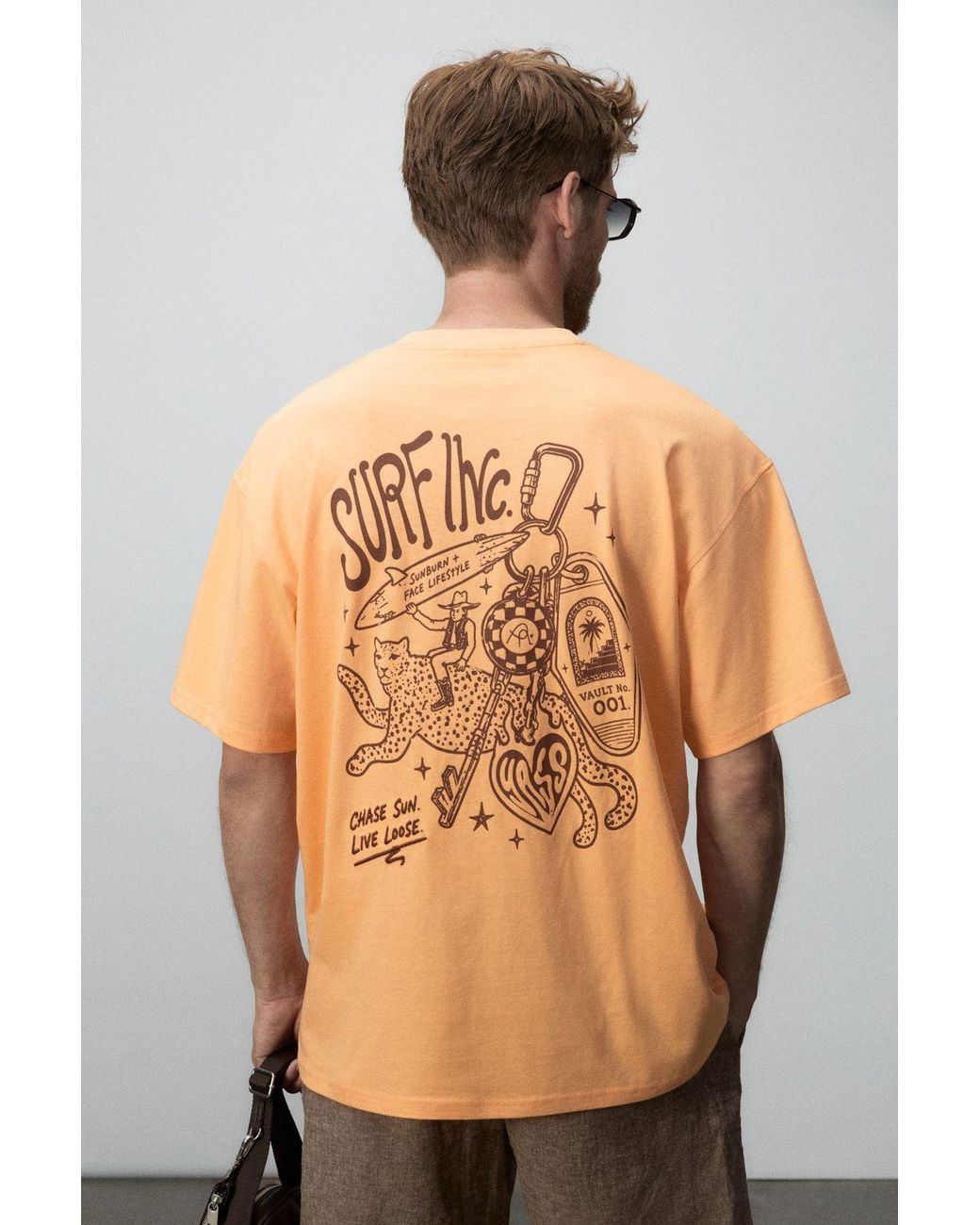 Grimelange Orange Oversized Printed Crew Neck T-Shirt for men