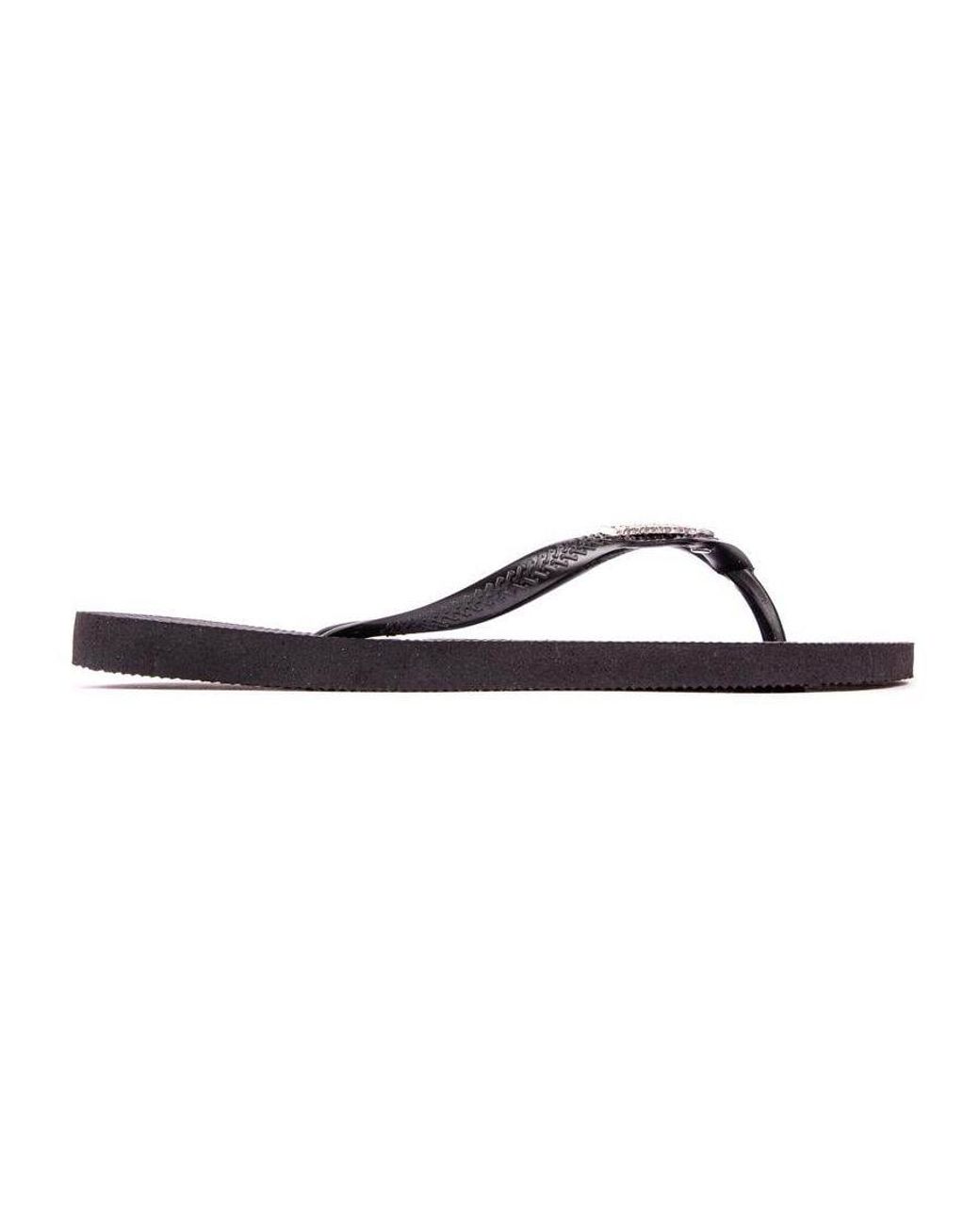 Black havaianas metal logo hot sale