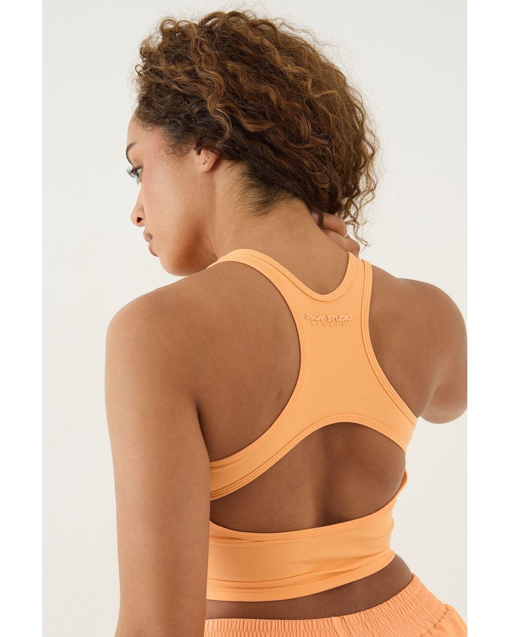 DSGN Studio Orange Ultra Sculpt Cut Out Racer Back Sports Bra