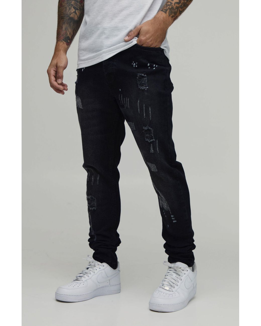 BoohooMAN Black Skinny Stretch All Over Rip & Repair Paint Splatter Jeans for men