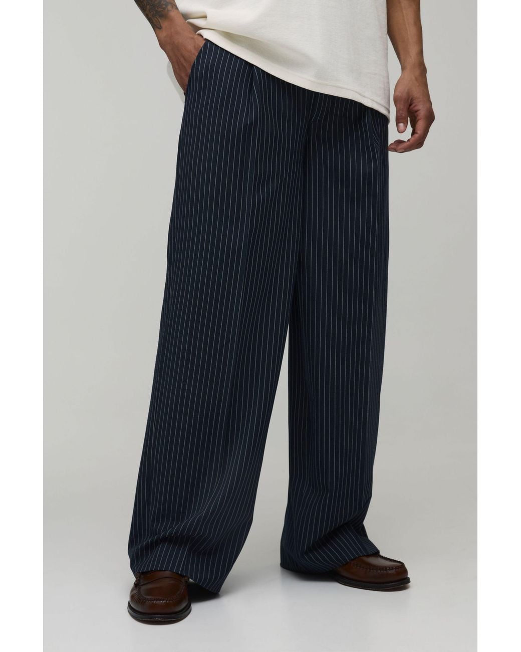 BoohooMAN Blue Baggy Fit Pinstripe Pleat Front Tailored Trousers for men