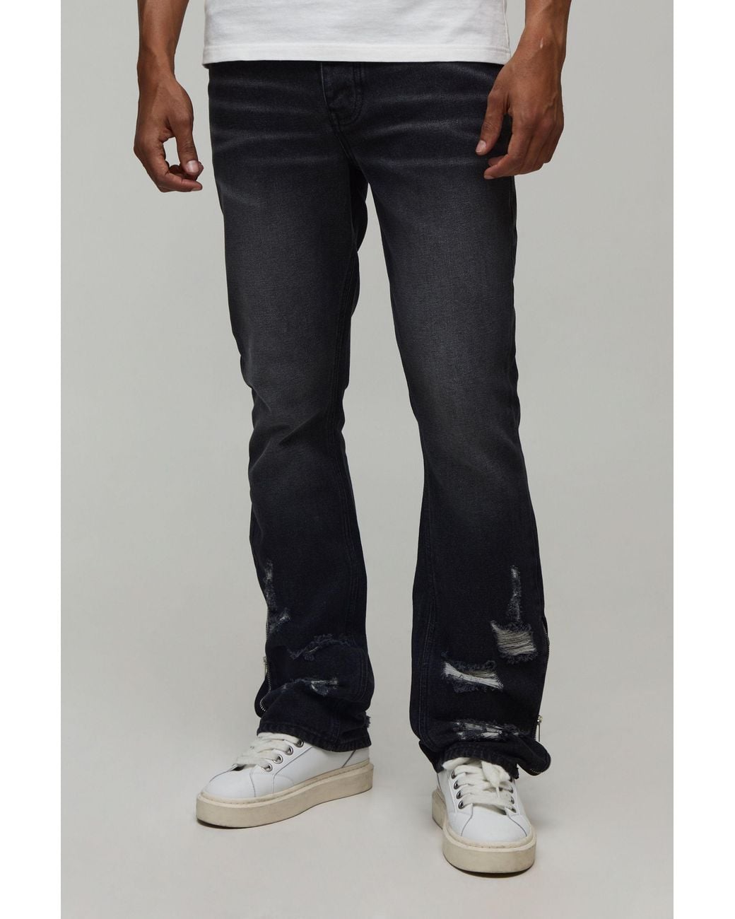 BoohooMAN Black Ripped Zip Hem Slim Stacked Flared Jeans for men