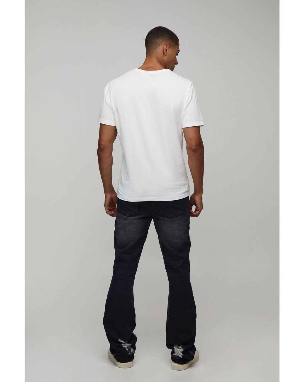 BoohooMAN Black Ripped Zip Hem Slim Stacked Flared Jeans for men