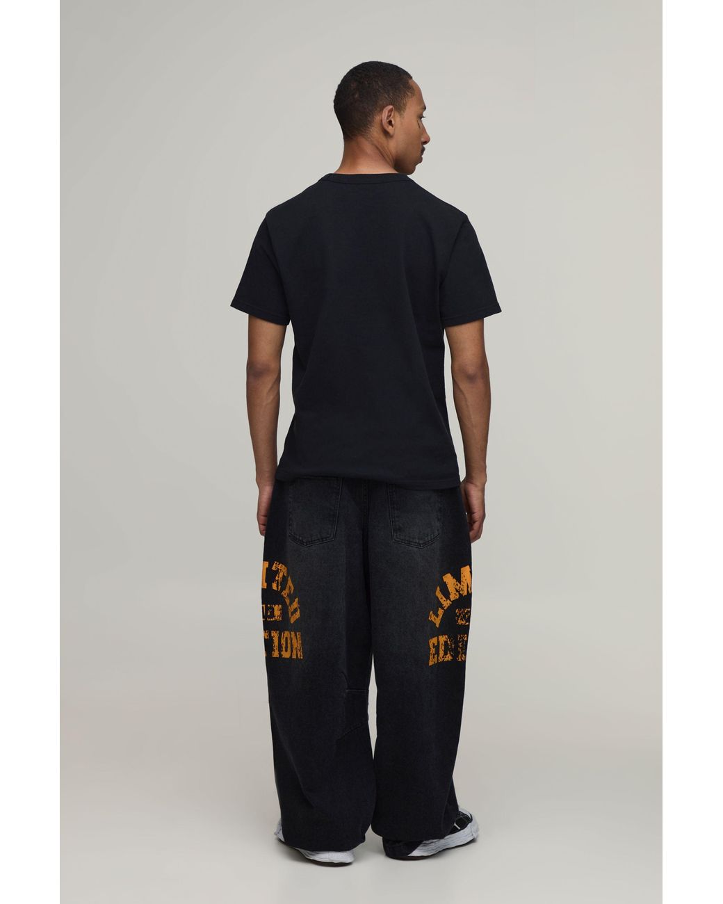 BoohooMAN Black Balloon Rigid Varsity Print Denim Jeans for men