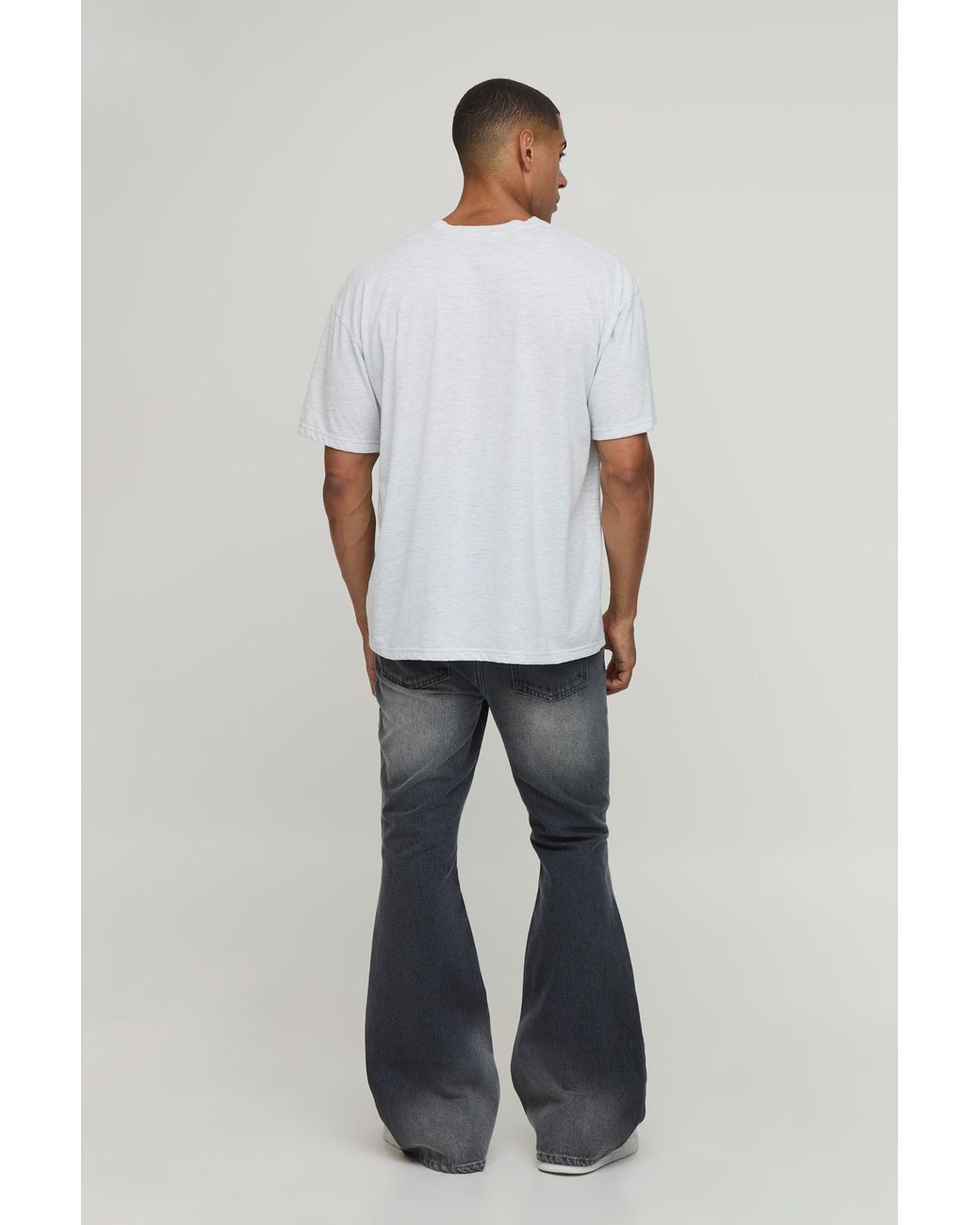 BoohooMAN Blue Crease Wash Ripped Knee Flared Jeans for men