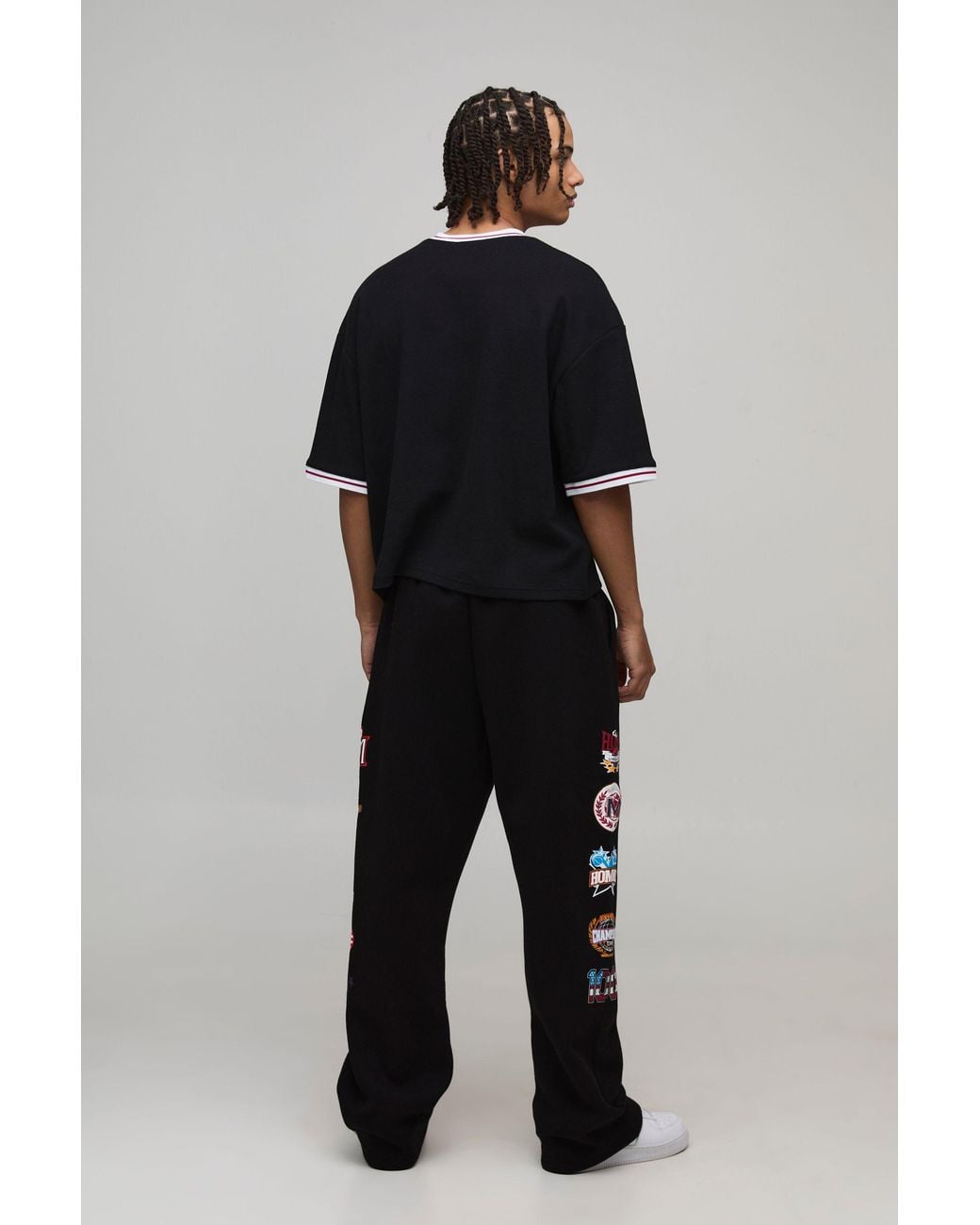 BoohooMAN Black Baggy Fit Varsity Badge Print Joggers for men