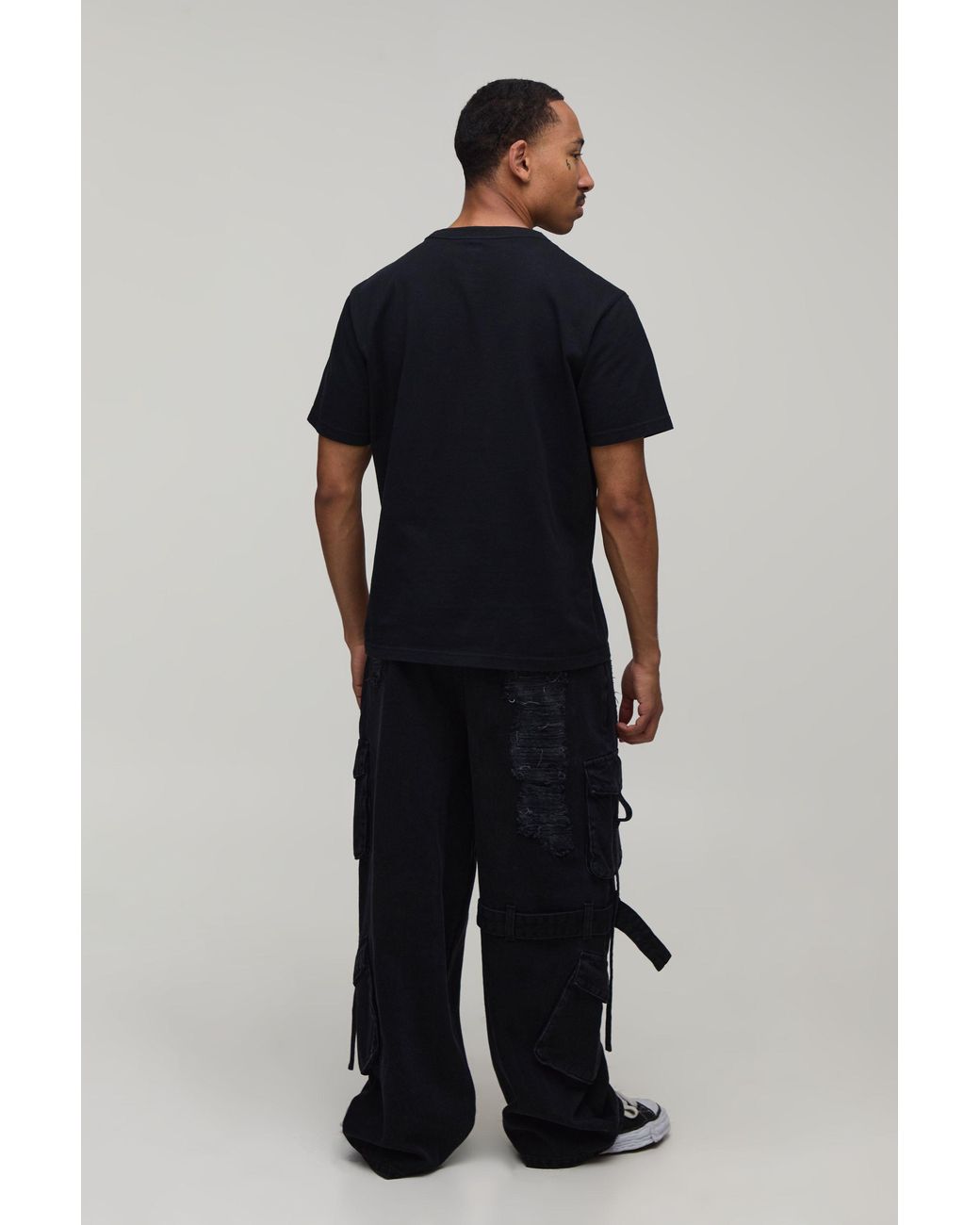 BoohooMAN Black Extreme Washed Cargo Strap Detail Baggy Jeans for men