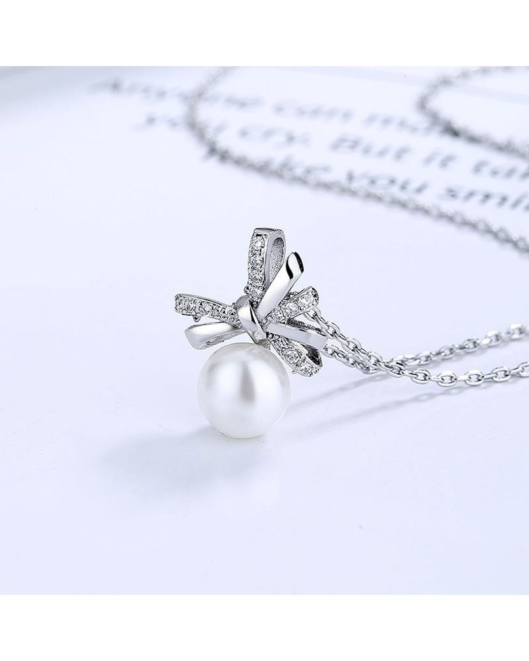 SVNX Blue Diamante Bow Pearl Necklace