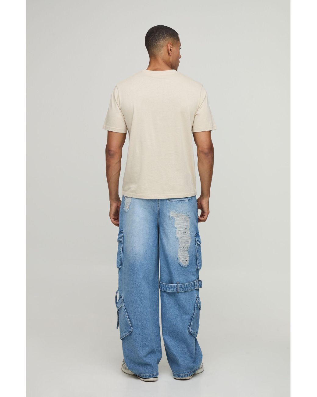 BoohooMAN Blue Extreme Washed Cargo Strap Detail Baggy Jeans for men
