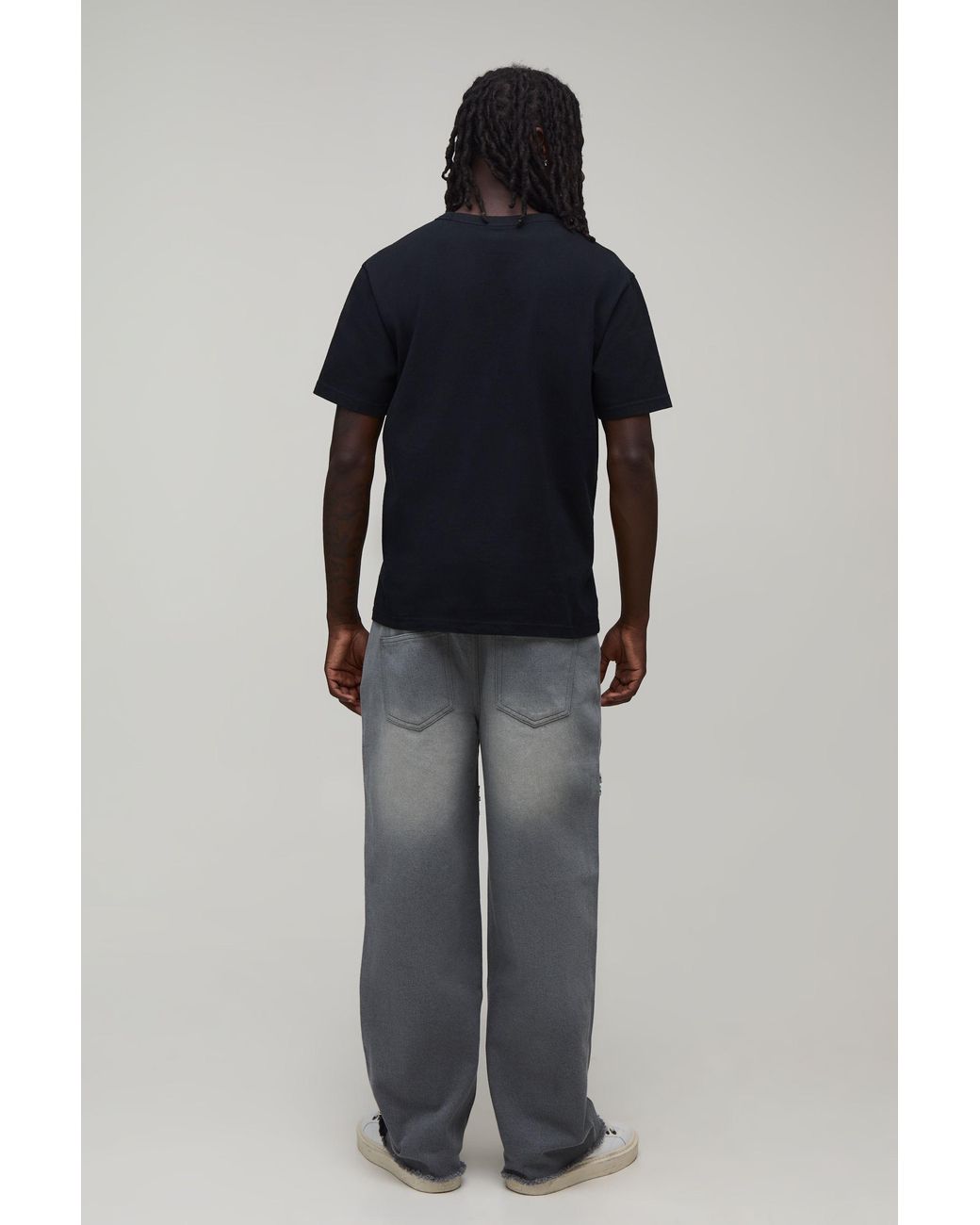 BoohooMAN Black Star Cut & Sew Relaxed Fit Jeans for men