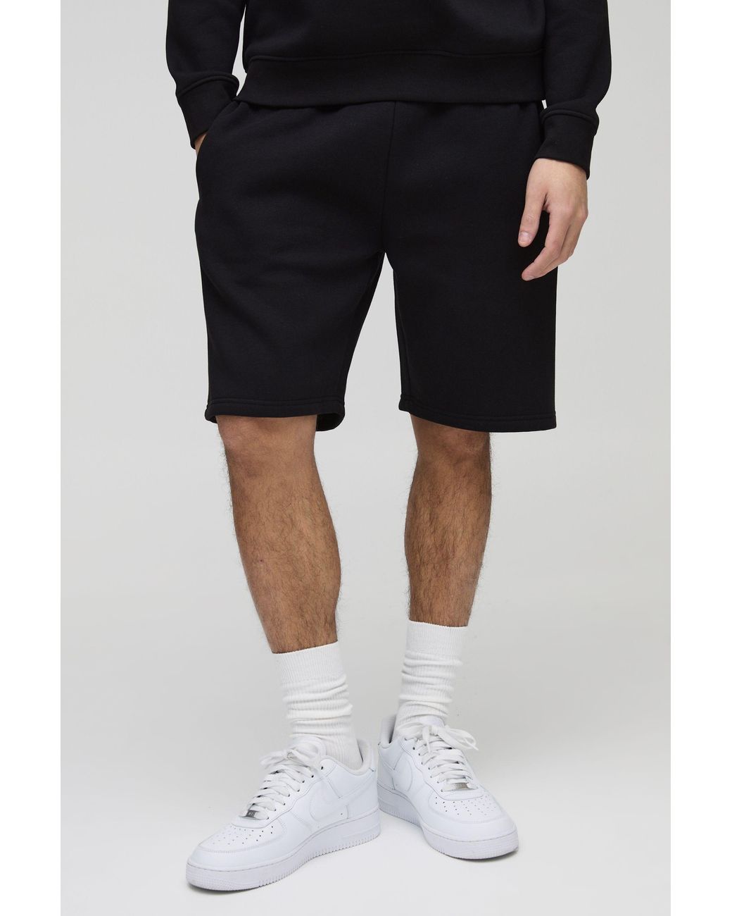 BoohooMAN Black Loose Fit Mid Length Basic Shorts for men