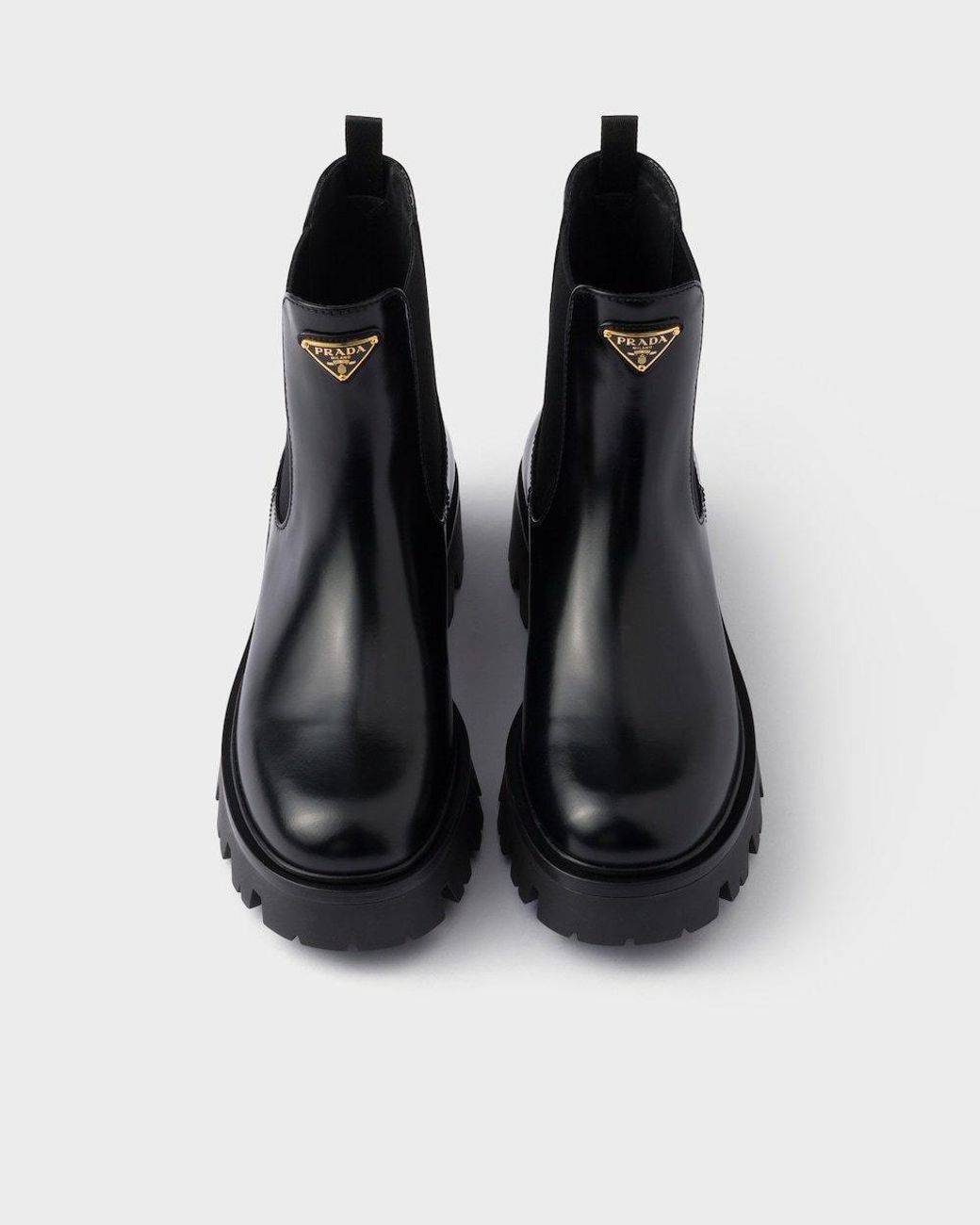 Prada Logo Plaque Slip-On Chelsea Boots in Black | Lyst