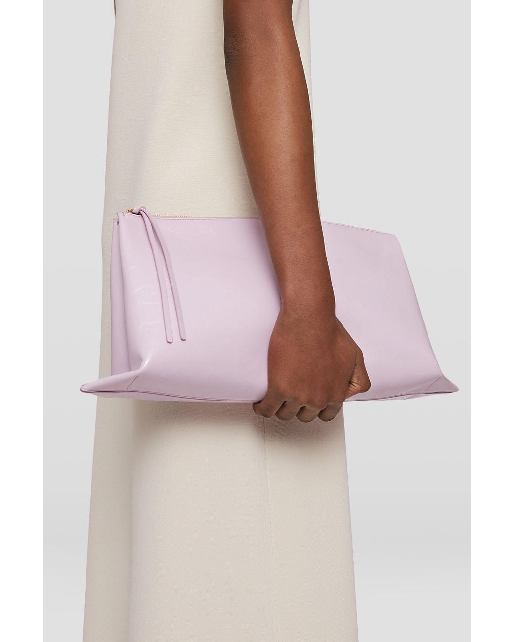 Jil Sander Purple Logo Embossed Zipped Clutch Bag