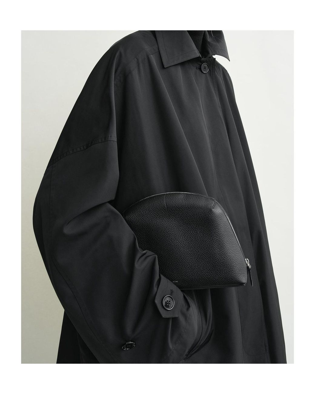 Totême Black Totême Curved Zip Leather Clutch Bag