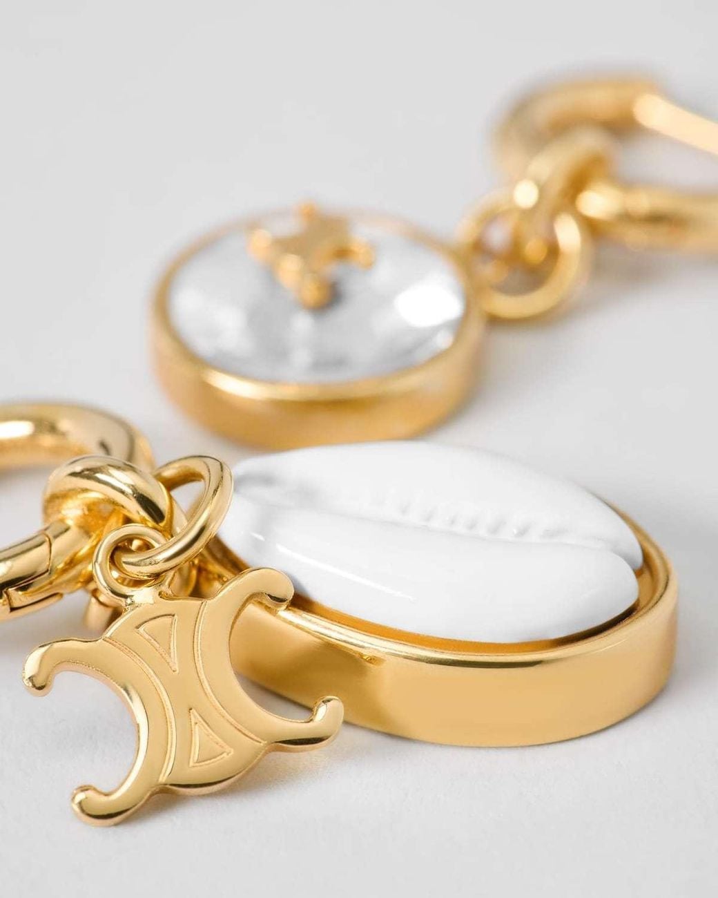 Céline Metallic Triumphal Shell Earrings