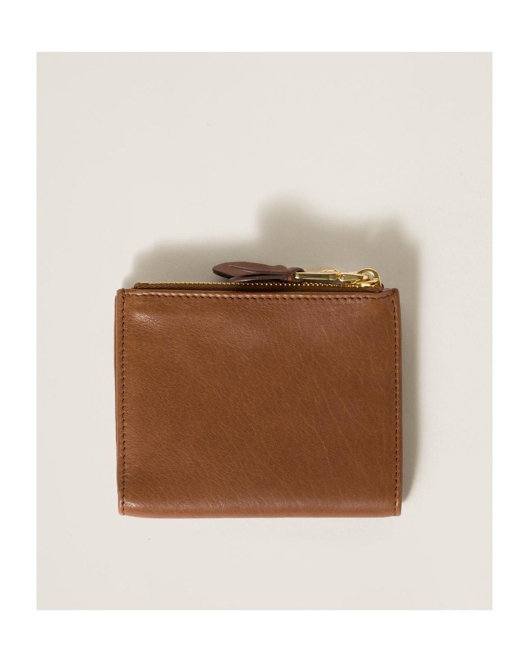 Miu Miu Brown Logo Embossed Zipped Wallet