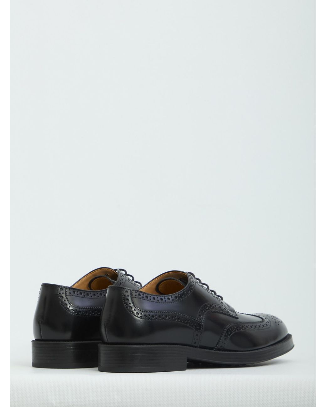 Tod's Black Wingtip Brogue Derby Shoes for men