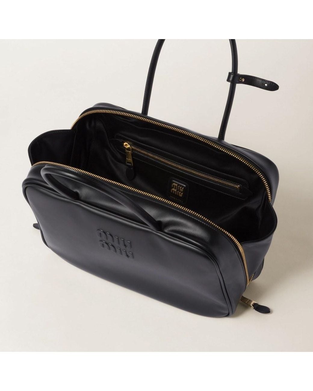 Miu Miu Black Logo-Embossed Zipped Handbag