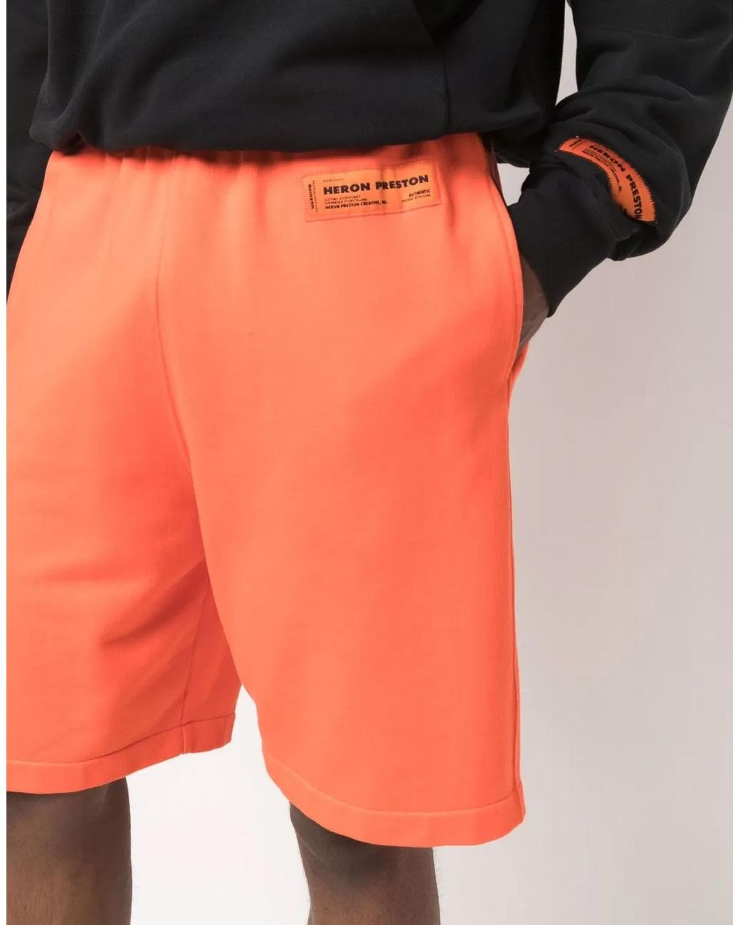 Heron Preston Orange Logo Shorts for men