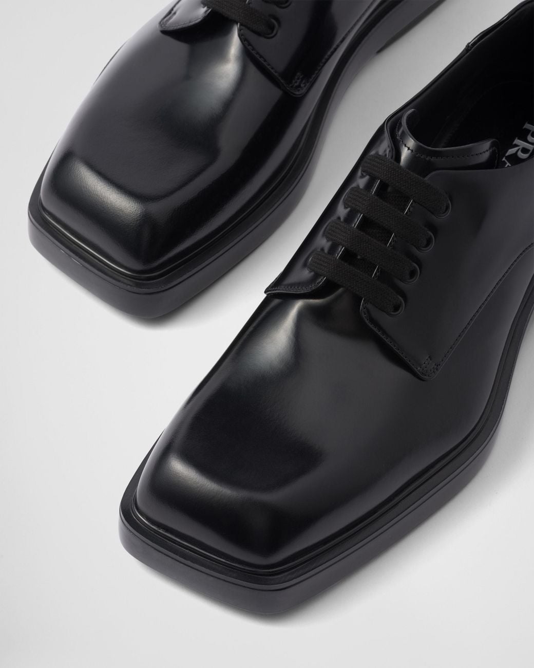 Prada Black Brushed Leather Derby Shoes for men