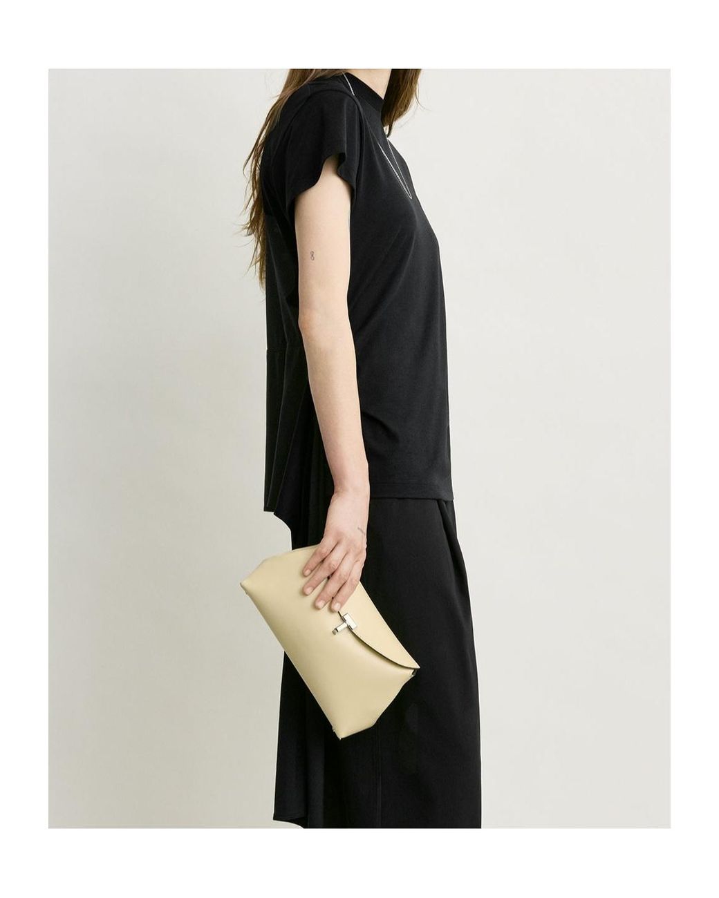 Totême Natural T-Lock Leather Clutch Bag